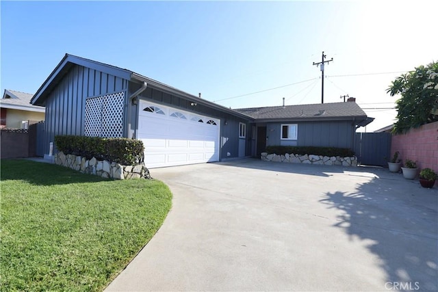 5519 Stevely Ave, Lakewood, CA 90713 - ranch-style home featuring board and batten siding, driveway, and an attached garage
