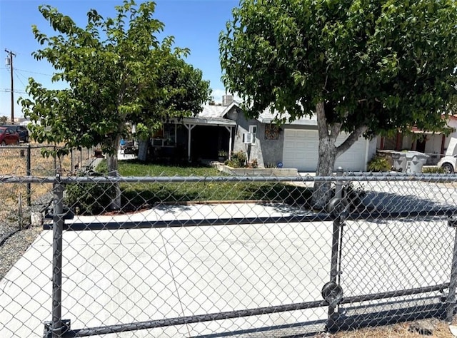 16472 Vine St, Hesperia, CA 92345 - view of property hidden behind natural elements with a garage and driveway