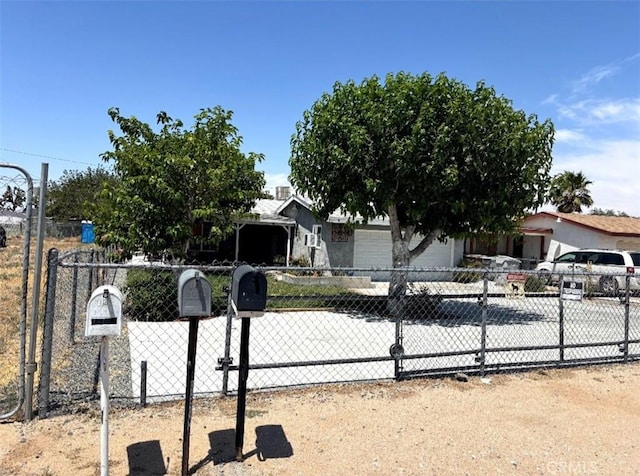 16472 Vine St, Hesperia, CA 92345 - obstructed view of property with a fenced front yard and a garage