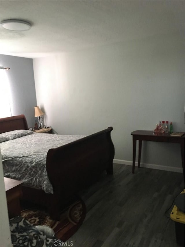 16472 Vine St, Hesperia, CA 92345 - bedroom featuring dark wood-style flooring and baseboards