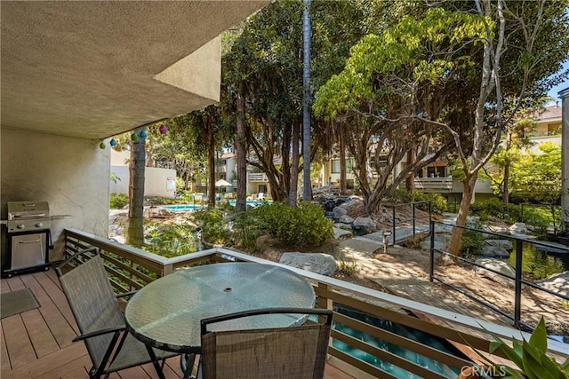 400 Brighton Spgs, Costa Mesa, CA 92627 - balcony with area for grilling, view of pool area, and outdoor dining area