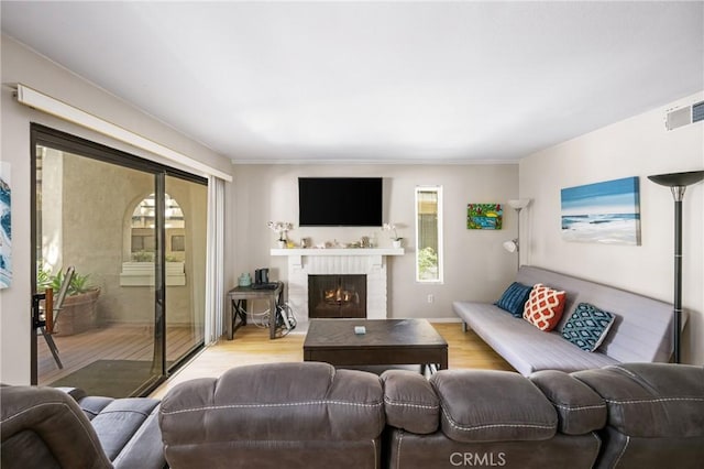 400 Brighton Spgs, Costa Mesa, CA 92627 - living area with wood finished floors and a brick fireplace