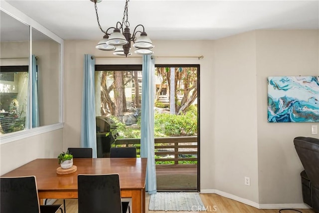 400 Brighton Spgs, Costa Mesa, CA 92627 - dining area featuring plenty of natural light, a chandelier, and wood finished floors