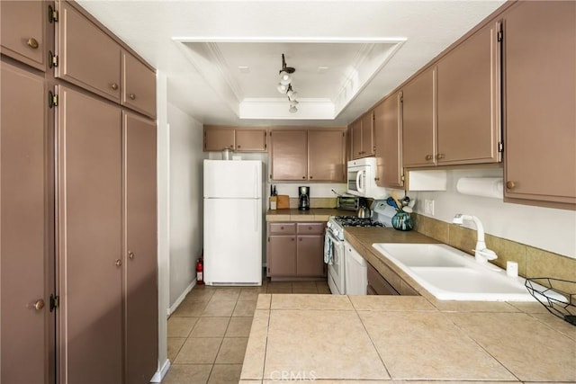 400 Brighton Spgs, Costa Mesa, CA 92627 - kitchen with white appliances, crown molding, a raised ceiling, tile counters, and light tile patterned flooring