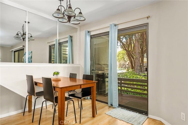 400 Brighton Spgs, Costa Mesa, CA 92627 - dining area featuring a chandelier and wood finished floors