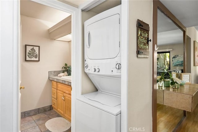 400 Brighton Spgs, Costa Mesa, CA 92627 - laundry area featuring stacked washer / drying machine and baseboards