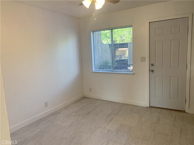 14299 La Paz Dr Unit 6, Victorville, CA 92395 - spare room with a ceiling fan and baseboards