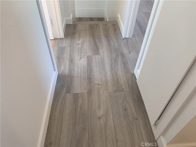 14299 La Paz Dr Unit 6, Victorville, CA 92395 - hallway with wood finished floors
