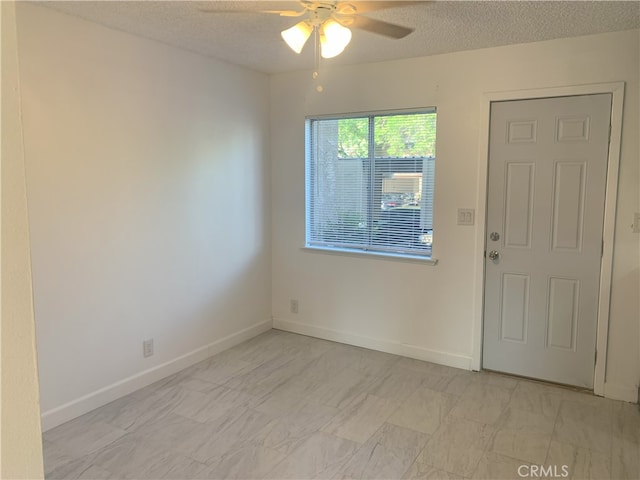 14299 La Paz Dr Unit 6, Victorville, CA 92395 - empty room with a ceiling fan and a textured ceiling