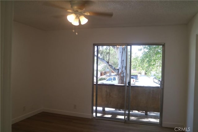 14299 La Paz Dr Unit 6, Victorville, CA 92395 - unfurnished room with dark wood-style floors, ceiling fan, and a textured ceiling