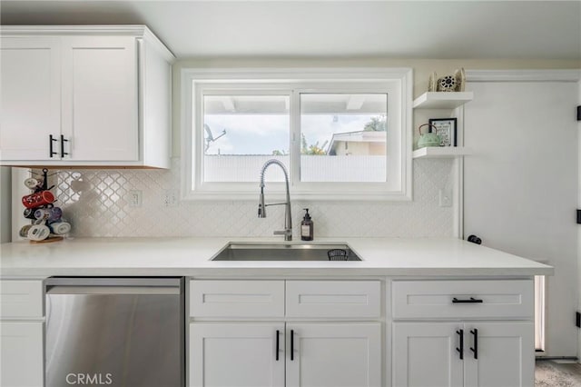 1925 W Beacon Ave, Anaheim, CA 92804 - kitchen with stainless steel dishwasher, open shelves, white cabinets, backsplash, and light countertops