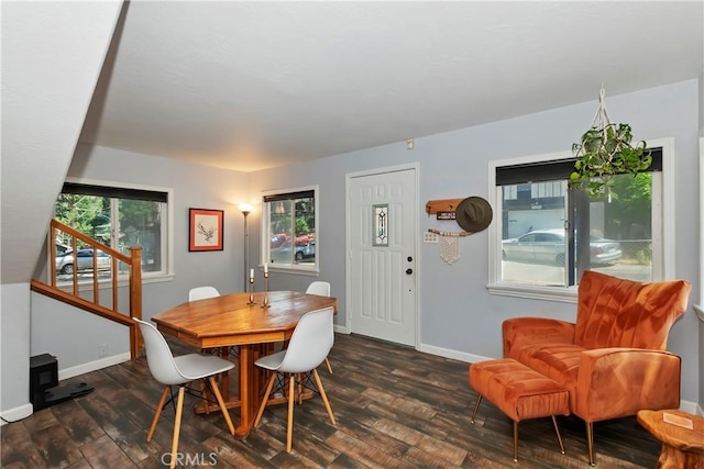 22989 Pine Ln, Crestline, CA 92325 - dining space featuring dark wood finished floors and stairs
