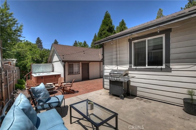22989 Pine Ln, Crestline, CA 92325 - view of patio with a hot tub, area for grilling, and an outdoor living space