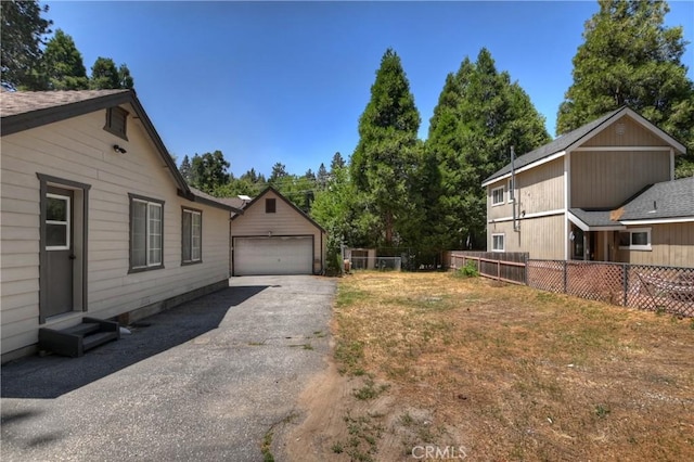 22989 Pine Ln, Crestline, CA 92325 - view of yard with a detached garage and entry steps