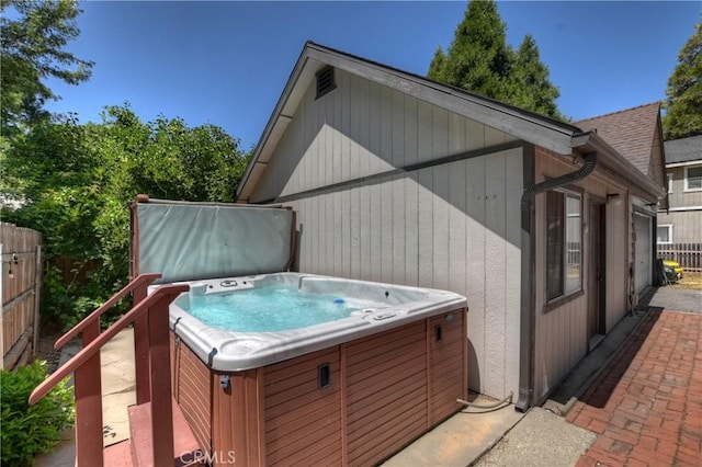 22989 Pine Ln, Crestline, CA 92325 - view of property exterior with a hot tub and a patio area