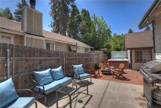 22989 Pine Ln, Crestline, CA 92325 - view of patio / terrace featuring a hot tub, area for grilling, and an outdoor living space