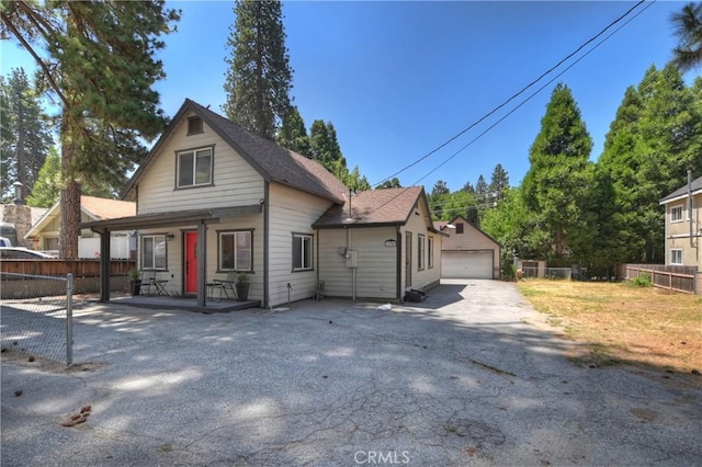 22989 Pine Ln, Crestline, CA 92325 - view of front facade featuring a porch and a detached garage
