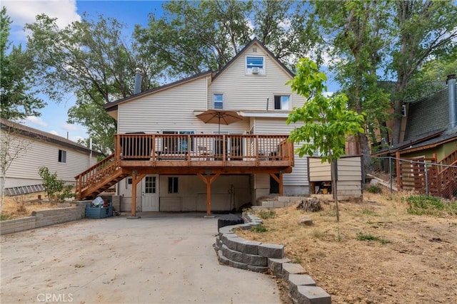 29289 Lake View Dr, Cedar Glen, CA 92321 - rear view of house featuring a wooden deck, stairway, and driveway