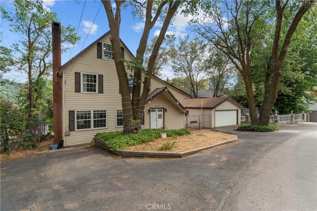 29289 Lake View Dr, Cedar Glen, CA 92321 - traditional-style home with a chimney and a garage