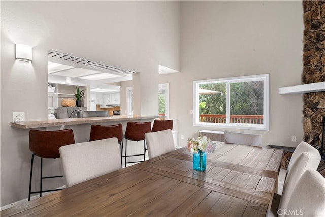 29289 Lake View Dr, Cedar Glen, CA 92321 - dining room featuring beamed ceiling, wood finished floors, and a towering ceiling