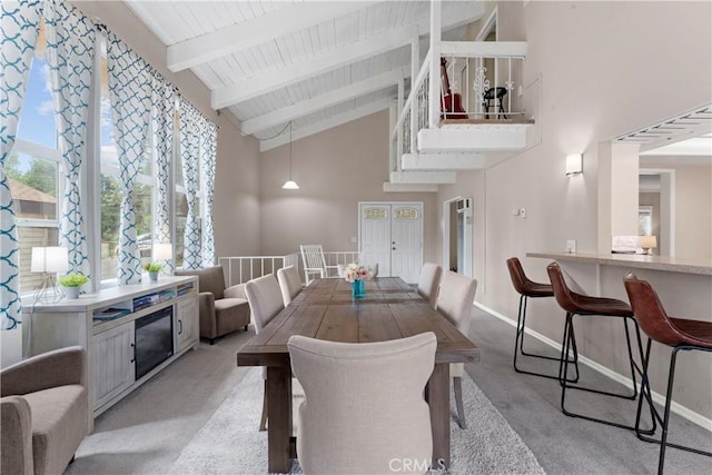 29289 Lake View Dr, Cedar Glen, CA 92321 - dining space with high vaulted ceiling, light colored carpet, and a wood ceiling with exposed beams
