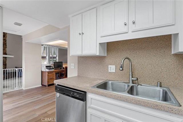 29289 Lake View Dr, Cedar Glen, CA 92321 - kitchen with stainless steel dishwasher, white cabinetry, tasteful backsplash, light countertops, and light wood-type flooring
