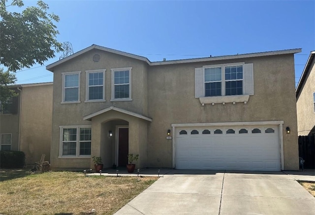 1169 Crescent Dr, Merced, CA 95348 - traditional home featuring stucco siding, driveway, a garage, and a front lawn
