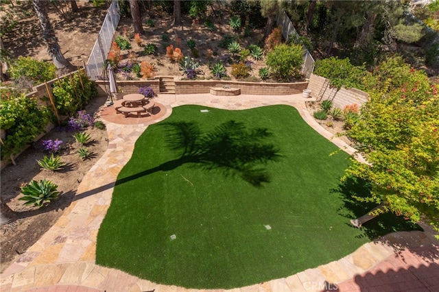 15535 Mallory Ct, Moorpark, CA 93021 - fenced backyard featuring an outdoor fire pit and a patio area