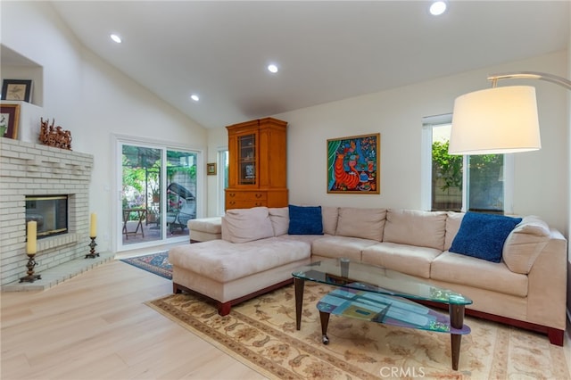 15535 Mallory Ct, Moorpark, CA 93021 - living area with recessed lighting, light wood-type flooring, a brick fireplace, and high vaulted ceiling