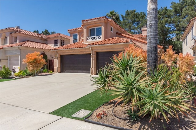 15535 Mallory Ct, Moorpark, CA 93021 - mediterranean / spanish home featuring driveway, a tile roof, a garage, and stucco siding