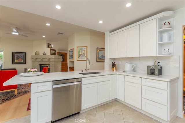 15535 Mallory Ct, Moorpark, CA 93021 - kitchen with stainless steel dishwasher, a peninsula, open floor plan, light countertops, and open shelves