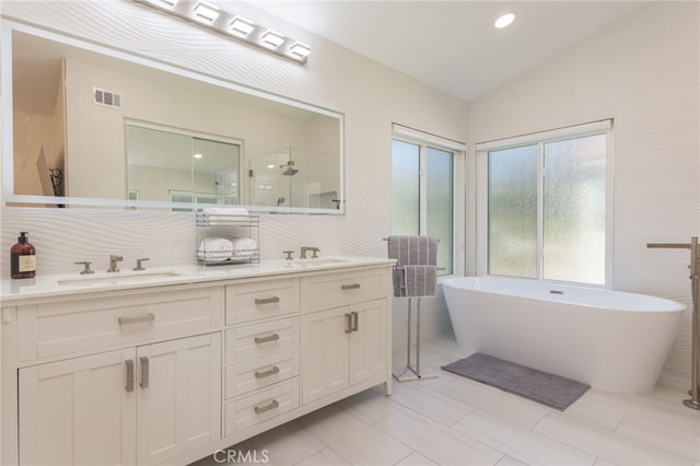 15535 Mallory Ct, Moorpark, CA 93021 - bathroom featuring double vanity, a freestanding bath, an enclosed shower, and vaulted ceiling