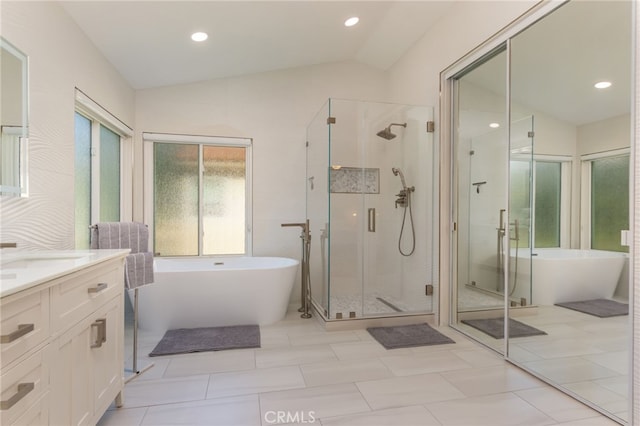 15535 Mallory Ct, Moorpark, CA 93021 - bathroom with lofted ceiling, vanity, a stall shower, a freestanding bath, and recessed lighting