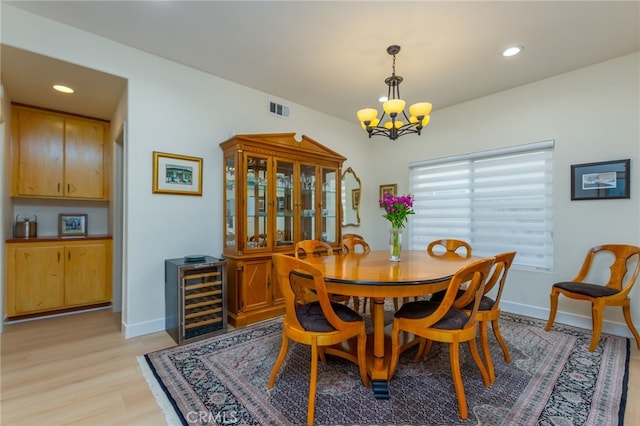 15535 Mallory Ct, Moorpark, CA 93021 - dining space featuring wine cooler, a chandelier, light wood-style flooring, and recessed lighting