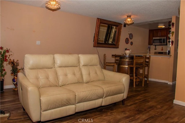 4727 W 147th St Unit 251, Lawndale, CA 90260 - living area with a textured ceiling and dark wood finished floors