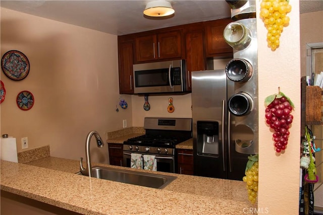 4727 W 147th St Unit 251, Lawndale, CA 90260 - kitchen with stainless steel appliances, light stone counters, and a peninsula