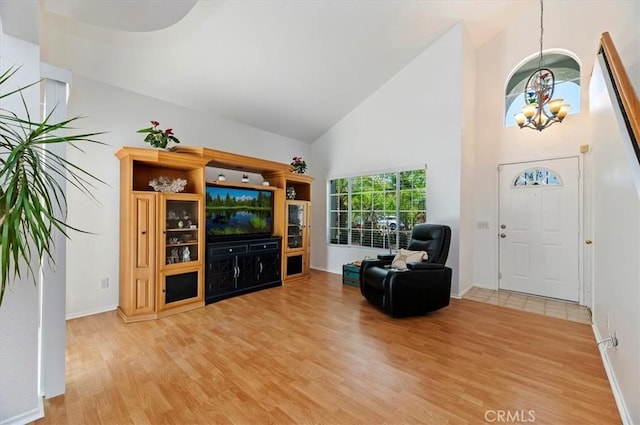 44938 Tehachapi, Temecula, CA 92592 - living room featuring a chandelier, high vaulted ceiling, and light wood finished floors