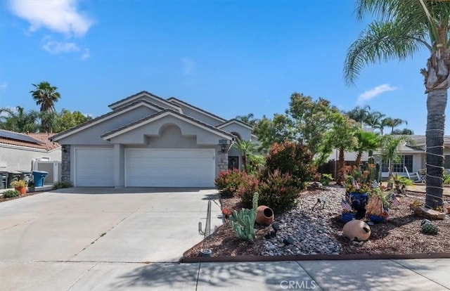 44938 Tehachapi, Temecula, CA 92592 - ranch-style home with driveway, stucco siding, a garage, and stone siding