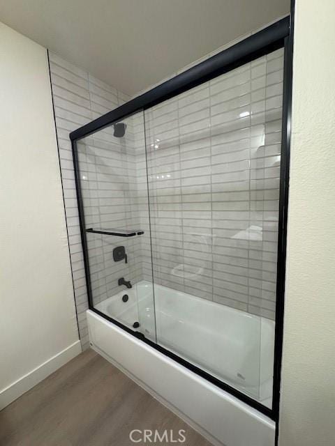 2501 W Sunflower Unit F12, Santa Ana, CA 92704 - full bathroom with wood finished floors and enclosed tub / shower combo