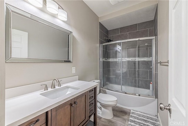 4664 Quartz Hill Rd, Quartz Hill, CA 93536 - bathroom featuring vanity, wood finished floors, and combined bath / shower with glass door