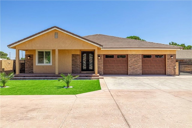 4664 Quartz Hill Rd, Quartz Hill, CA 93536 - view of front of house with an attached garage, concrete driveway, stucco siding, and stone siding