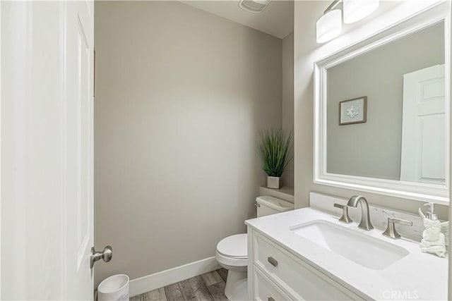 4664 Quartz Hill Rd, Quartz Hill, CA 93536 - half bathroom with wood finished floors and vanity