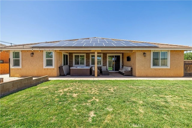 4664 Quartz Hill Rd, Quartz Hill, CA 93536 - back of house featuring a hot tub, stucco siding, solar panels, a patio, and an outdoor hangout area