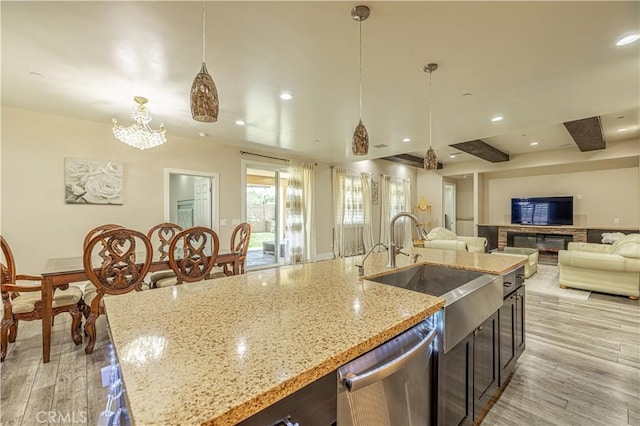 4664 Quartz Hill Rd, Quartz Hill, CA 93536 - kitchen with stainless steel dishwasher, open floor plan, pendant lighting, light wood-style floors, and recessed lighting
