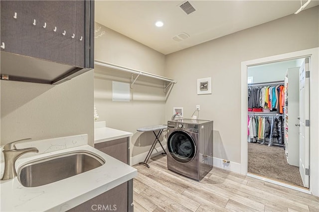4664 Quartz Hill Rd, Quartz Hill, CA 93536 - laundry room featuring washer hookup, light wood-style flooring, recessed lighting, and cabinet space