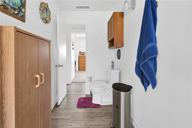 15761 Joshua Rd, Apple Valley, CA 92307 - bathroom featuring toilet and wood finished floors