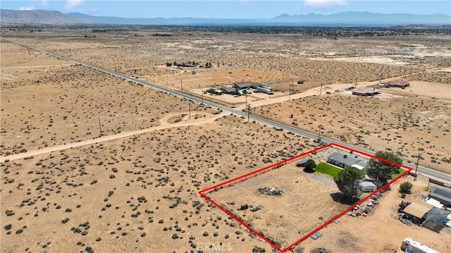 15761 Joshua Rd, Apple Valley, CA 92307 - aerial view of sparsely populated area with a mountain backdrop and property boundaries highlighted