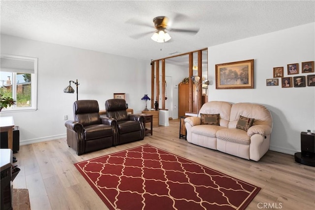 15761 Joshua Rd, Apple Valley, CA 92307 - living room with ceiling fan, wood finished floors, and a textured ceiling