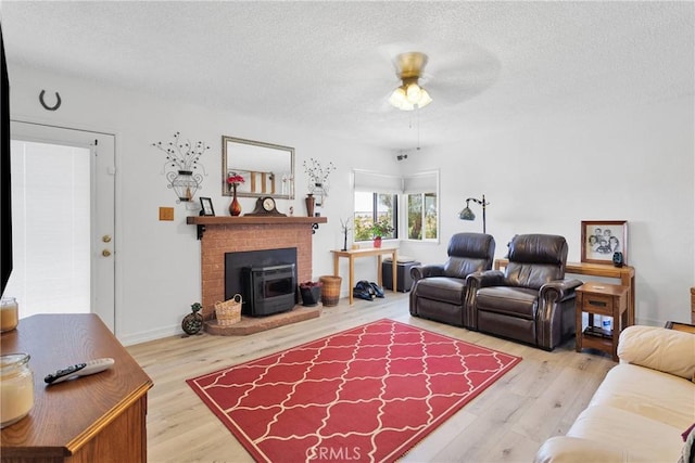 15761 Joshua Rd, Apple Valley, CA 92307 - living area featuring a textured ceiling, wood finished floors, and a ceiling fan