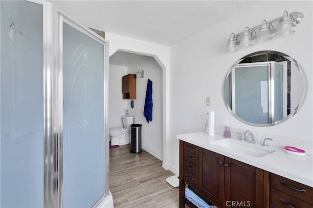 15761 Joshua Rd, Apple Valley, CA 92307 - bathroom featuring vanity, a shower stall, and wood finished floors